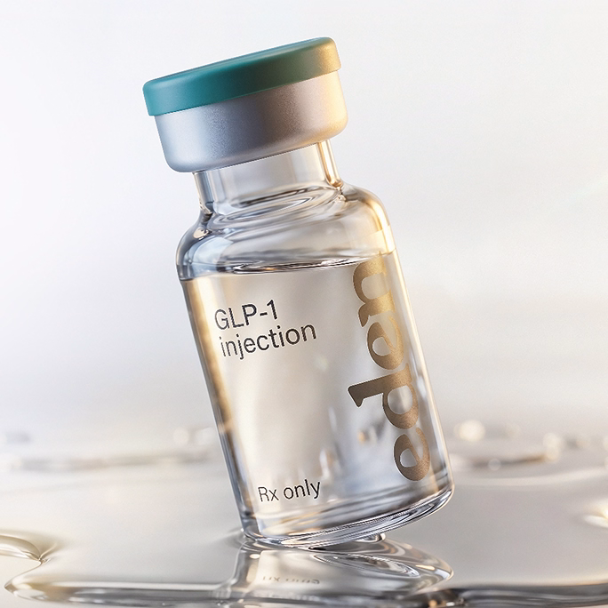 Close-up product photo of an Eden compounded-medication vial, lit in warm natural light