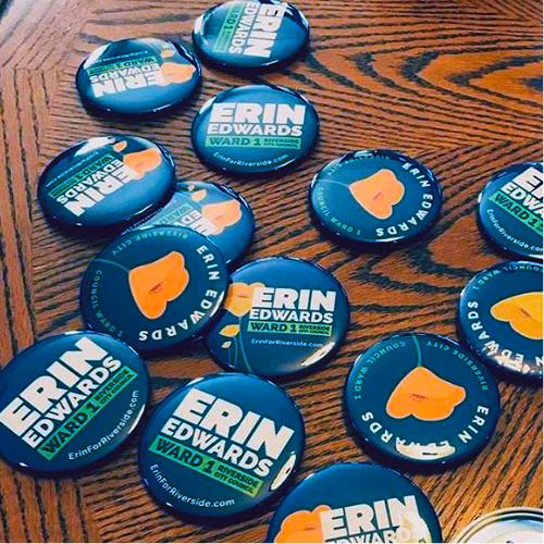 Close-up of round Erin Edwards campaign buttons